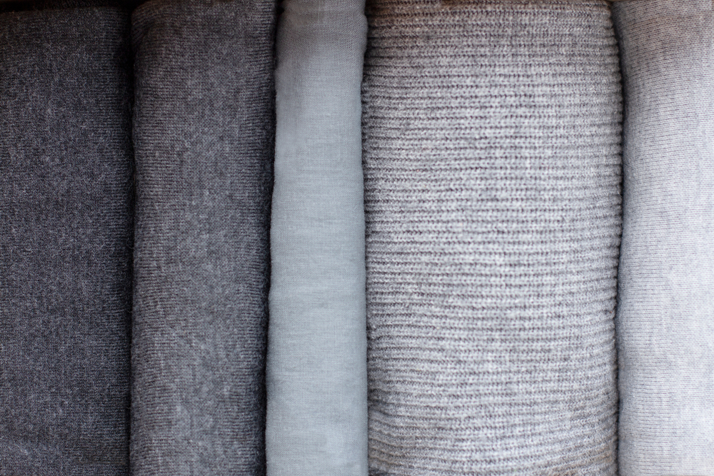 warmknittedclothesofgrayshadesareneatlyfoldedin
